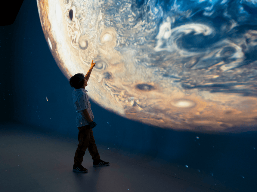 Kid Pointing At Planet